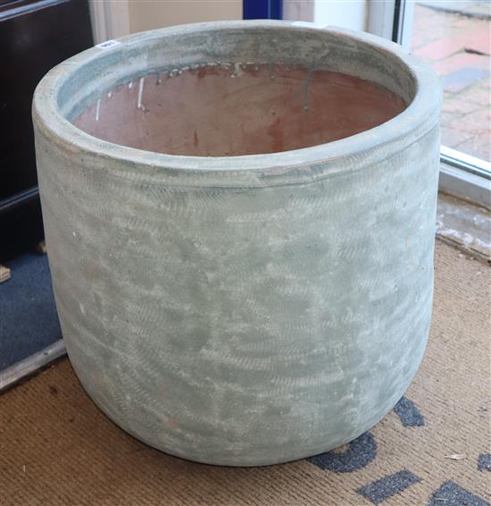 A pair of green glazed planters Diameter 49cm